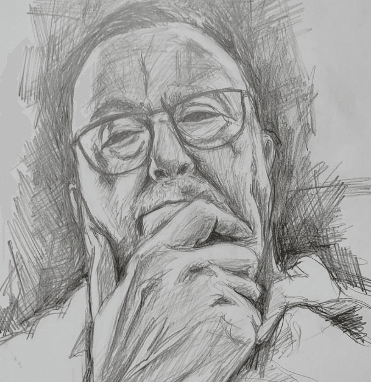 Portrait of Rafel smiling in his studio